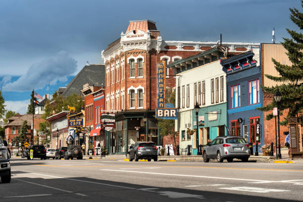 Leadville Colorado historic old mining town Main Street shops and buildings Leadville, Colorado - September 20, 2023: People and traffic move along the downtown Main Street of the historic old mining town in Leadville Colorado leadville stock pictures, royalty-free photos & images