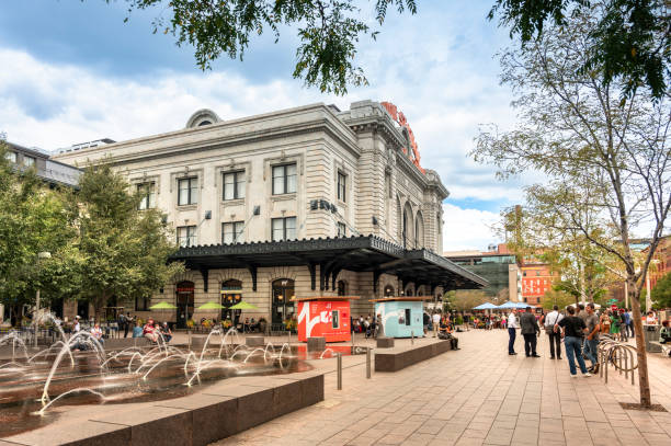 Denver, Colorado - September 18, 2023:  People walk by the Denver Colorado Union Station railway and public transportation commuter train hub in the downtown district