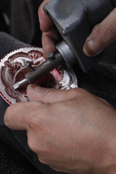 Ancient cultural handcrafted copper plate making in the workshop