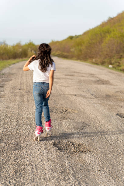 A girl on rollerblanding.