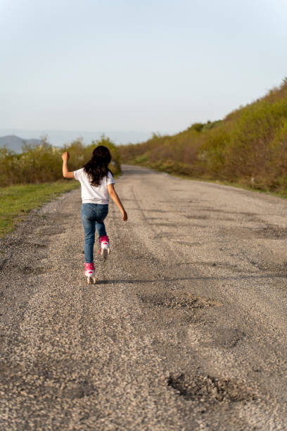 A girl on rollerblanding.