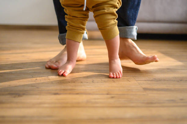 istock Toddler's First Steps with Parent Support at Home 2151945901