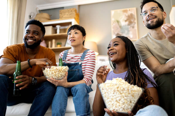 istock Group of ecstatic friends cheering for their team 2151947002