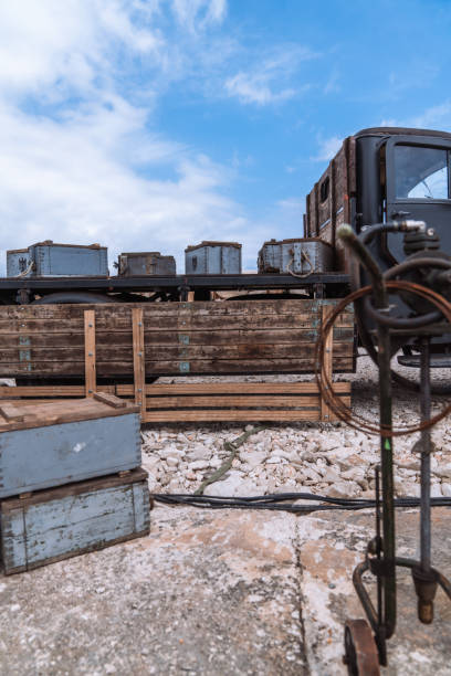 Old wooden crates used for storing army ammunition, showcasing a weathered and rustic appearance.