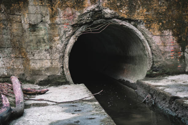 istock Sewage drainage pipe, sewage flows from the collector. Environmental pollution 2151949743