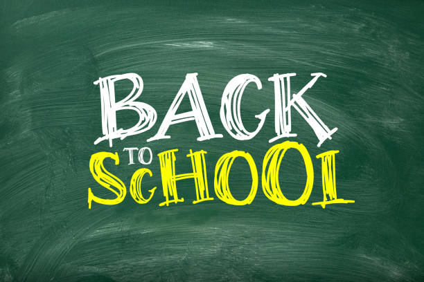 Green chalkboard with BACK TO SCHOOL lettering. Blackboard with chalk traces and smudges.
