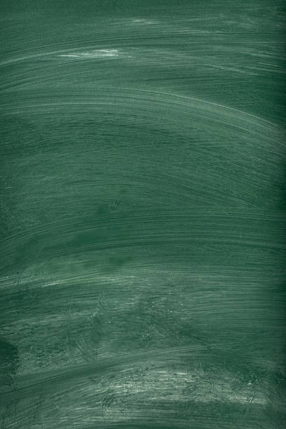 Empty school chalkboard background with chalk traces and space for copy