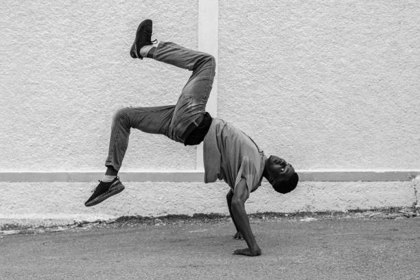 A Young Boy Dancing in the Street