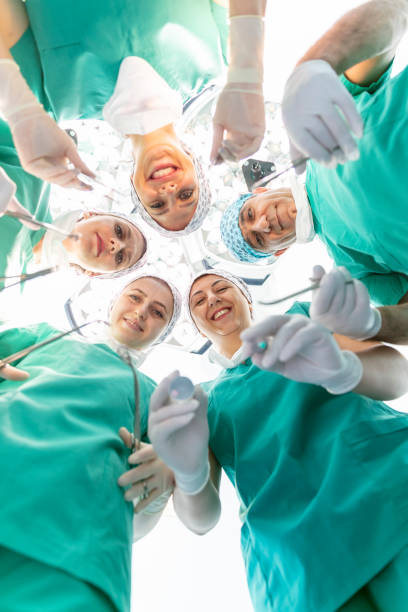 istock Team of nurses and surgeons in surgery. 2151956864