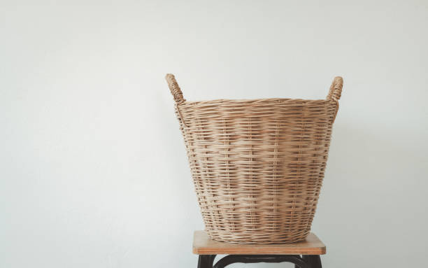 istock Empty wooden wicker basket isolated on white background. Vintage hamper basket laundry clothes. 2151956875
