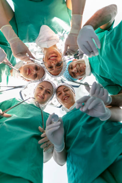 istock Team of nurses and surgeons in surgery. 2151956961