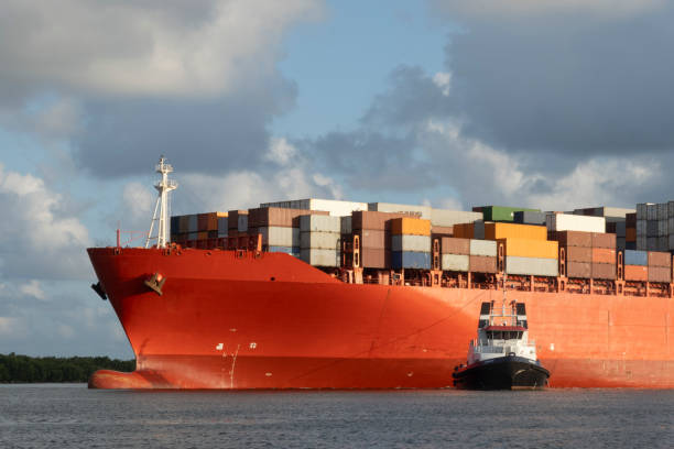 istock Cargo ship with containers departing from the seaport 2151958887