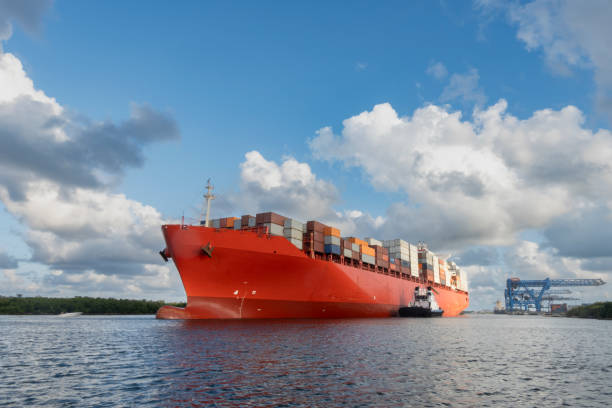 istock Cargo ship with containers departing from the seaport 2151958891