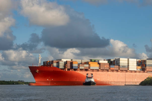 Cargo ship departing from Port Everglades with tugboat assistance, Fort Lauderdale, Florida, USA