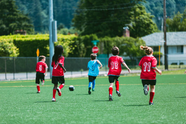 istock Young soccer players run after the ball 2151963143
