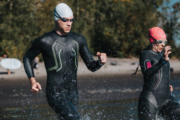 istock Triathletes racing to begin open water swim 2151963383