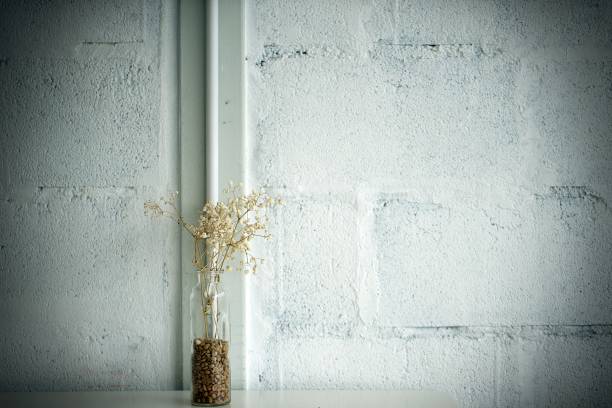 istock Glass vase with dried flower on table 2151963465