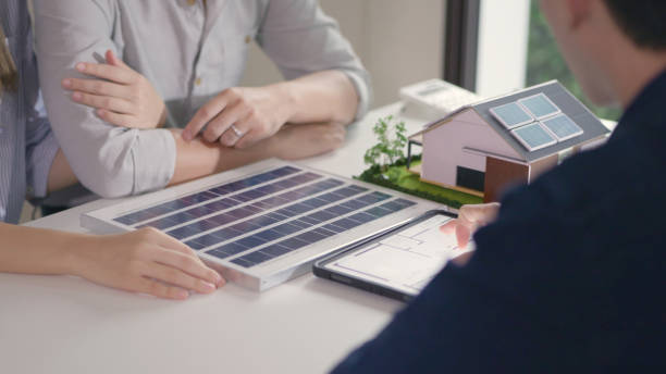 istock Professionals Discussing Solar Energy Solutions for Homes. 2151964482