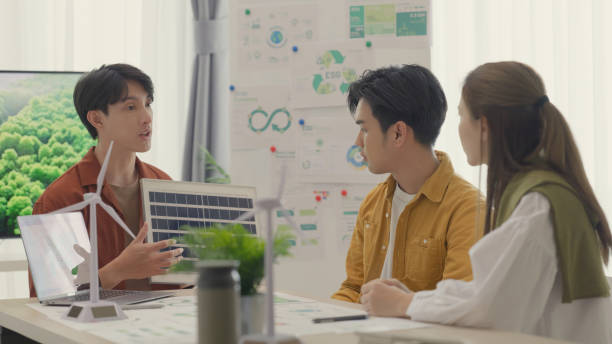 istock Team Discusses Integration of Solar and Wind Energy in ESG Strategy. 2151964494