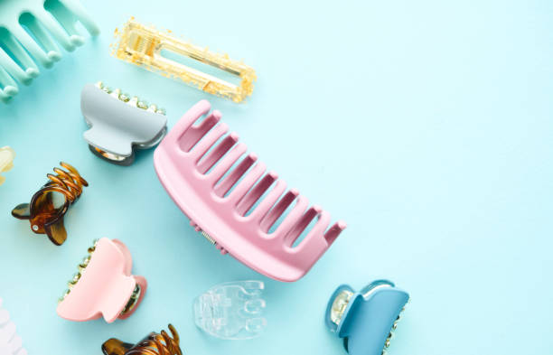 A collection of hair accessories on a blue background with space for text