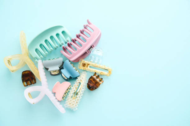 istock A collection of hair accessories on a blue background with space for text 2151964735