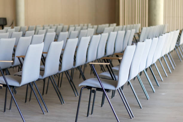 istock .conference hall with row upon row of chairs 2151968413