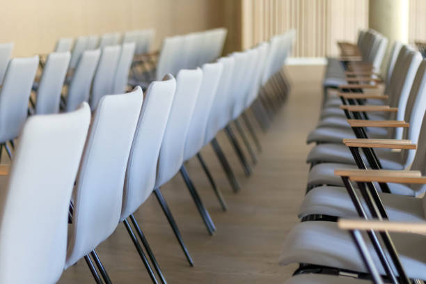 istock .conference hall with row upon row of chairs 2151968417