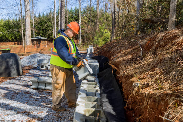 istock During installation of concrete block retaining wall, contractor mounted a blocks 2151971364