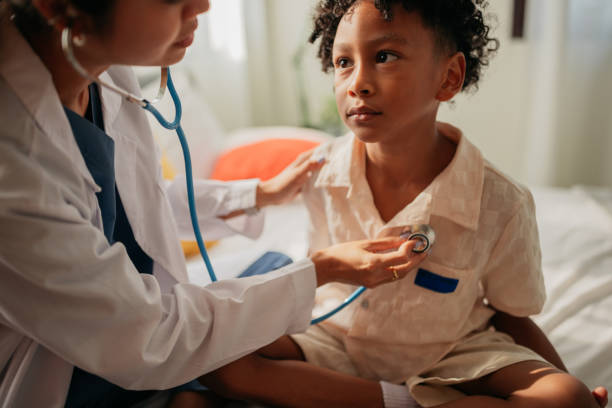 istock Female doctor examining boy 2151974194