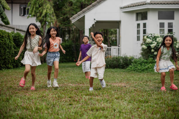 istock Children excitedly running in the yard 2151975347
