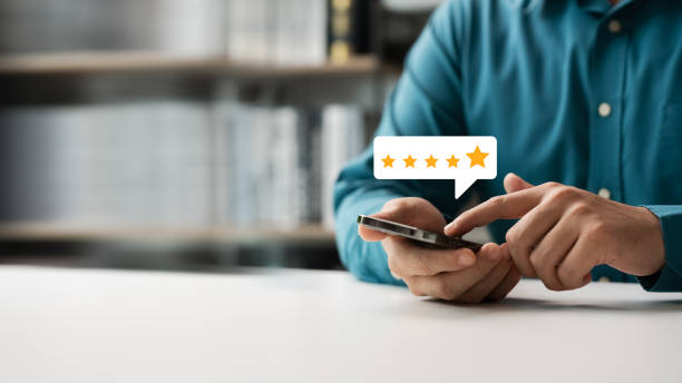 istock customer man using smartphone express satisfaction Golden five star level Excellent. 2151976661