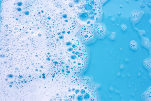 istock Detergent foam bubble on water. Blue background, Soap sud 2151978041