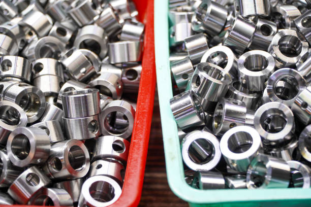 istock Shiny steel parts background. Regular industrial metal production pattern with selective focus.High precision steel automotive parts manufacturing by innovative CNC machining 2151978381