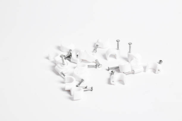 Cable nail clip, Plastic cable clips with steel nails isolated on white background