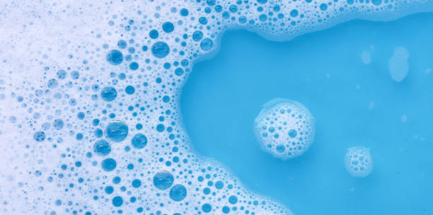 istock Detergent foam bubble on water. Blue background, Soap sud 2151980665