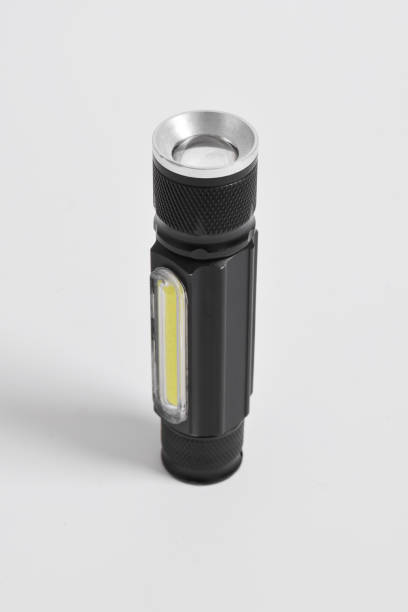 istock Modern metal LED flashlight in black color 2151982385