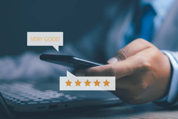 istock Businessman using smartphone giving high score for feedback review satisfaction service. Customer satisfaction experience with five star icon and excellent for feedback review satisfaction service. 2151983971