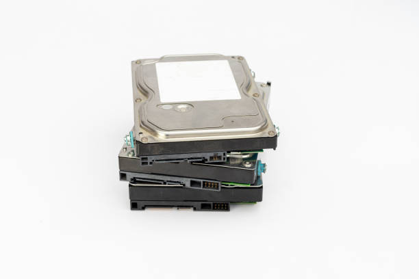 A pile of 3.5 inch computer internal hard disk drives isolated on white background with copy space.