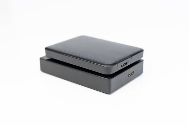 istock Two external hard drives for backup isolated on white background. 2151984060