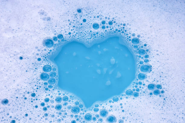 istock Detergent foam bubble on water. Blue background, Soap sud 2151986282