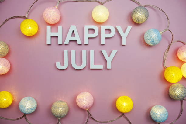 istock Happy July alphabet letters on pink background 2151986416