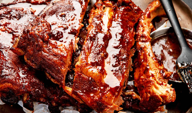 istock Grilled and smoked ribs with barbeque sauce. 2151986618