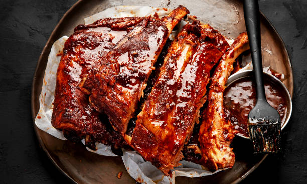 istock Grilled and smoked ribs with barbeque sauce. 2151986622