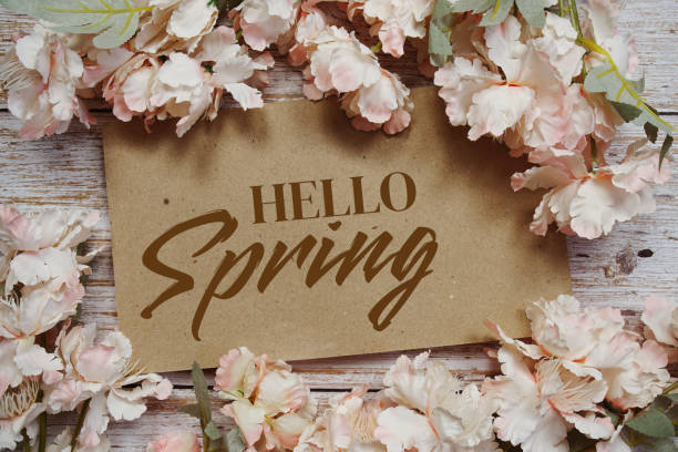 istock Hello Spring typography text with flowers frame on wooden background 2151986807