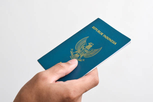 istock Man holding Indonesian Passport 2151987516