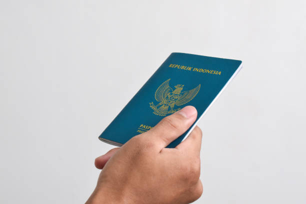 istock Man holding Indonesian Passport 2151987519