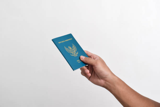 istock Man holding Indonesian Passport 2151987529