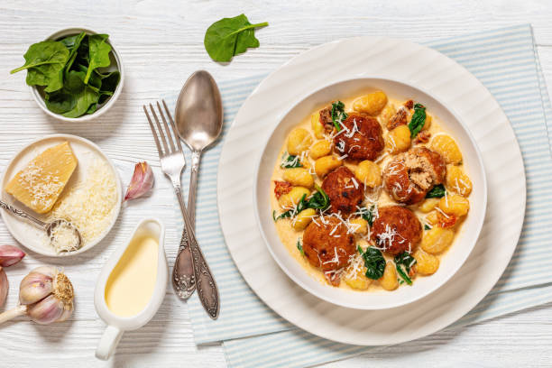 istock tuscan chicken meatballs with gnocchi in a bowl 2151987715