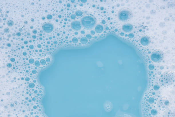 istock Detergent foam bubble on water. Blue background, Soap sud 2151987832