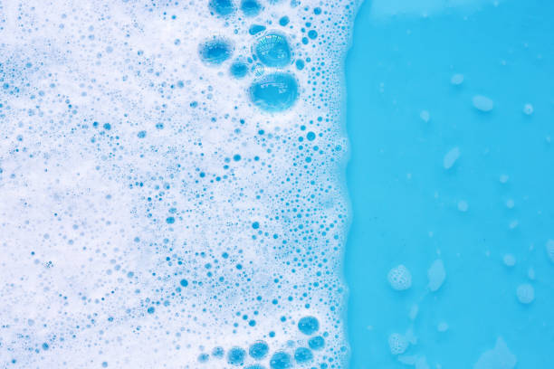 istock Detergent foam bubble on water. Blue background, Soap sud 2151988193